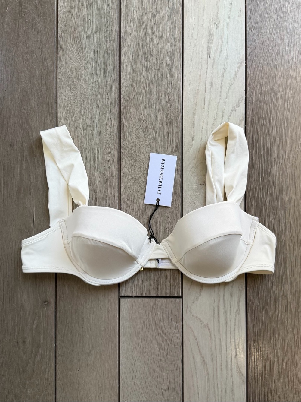 WeWoreWhat bikini top featuring underwire cups and thick straps